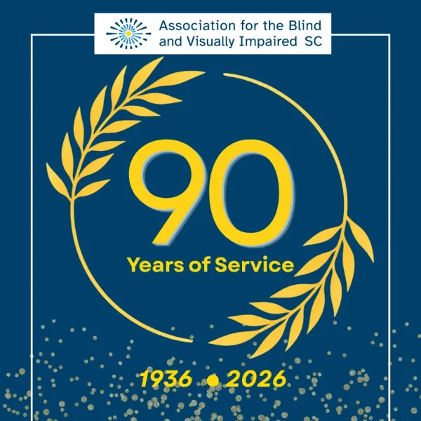 On a dark blue background, a gold wreath encircles text that reads 90 years of service. Text at bottom displays the dates 1936 to 2026.