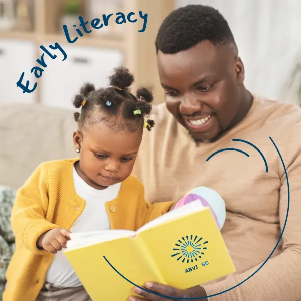 Early Literacy Dots and Tots A dad reads to his toddler daughter. Text reads Early Literacy.