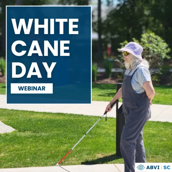 A woman wearing a bucket hat and sunglasses uses a long white cane to walk through a city park. Text to left reads White Cane Day. ABVI logo bottom right.